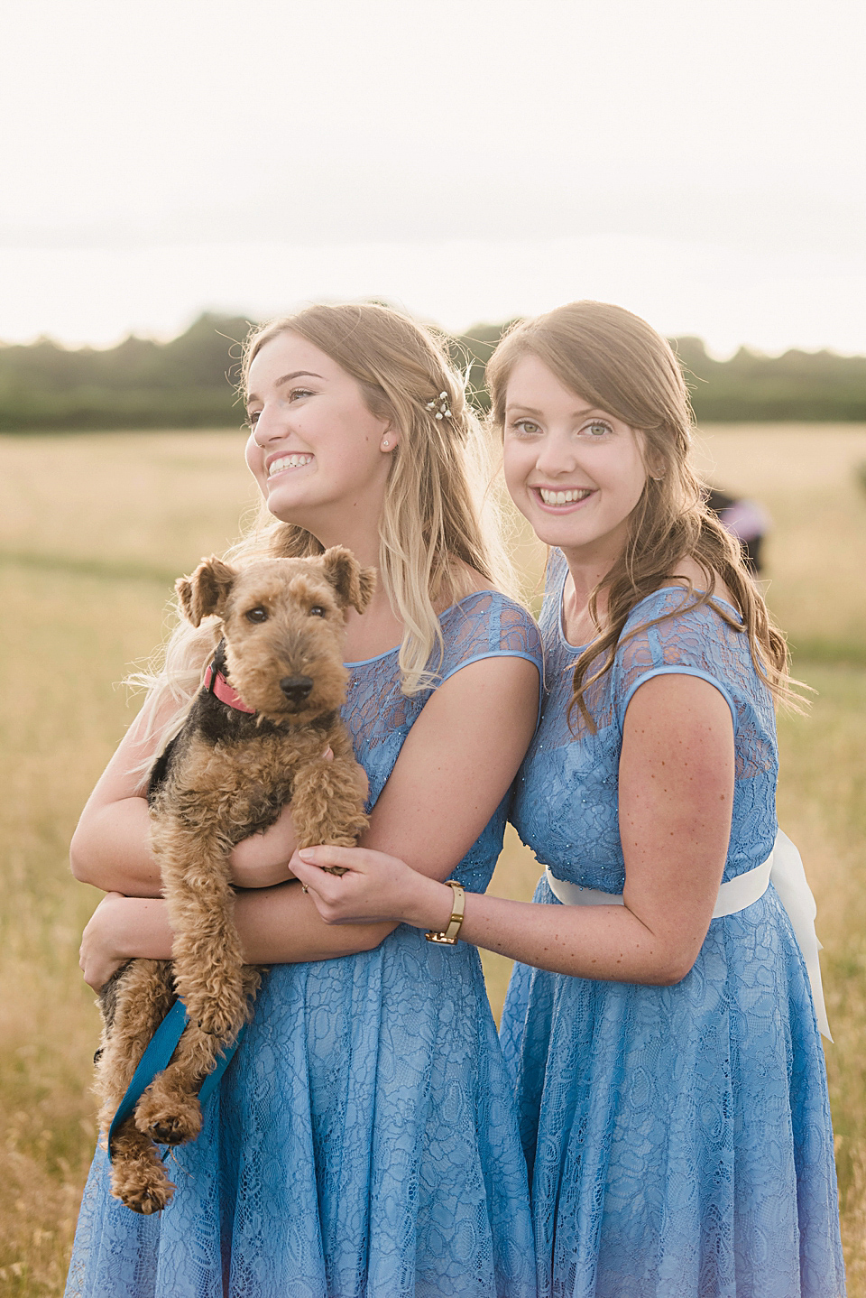 Bride Daisy wore a Stella York gown for her pale blue and flower filled Summer wedding in the English countryside. Photography by Faye Cornhill.