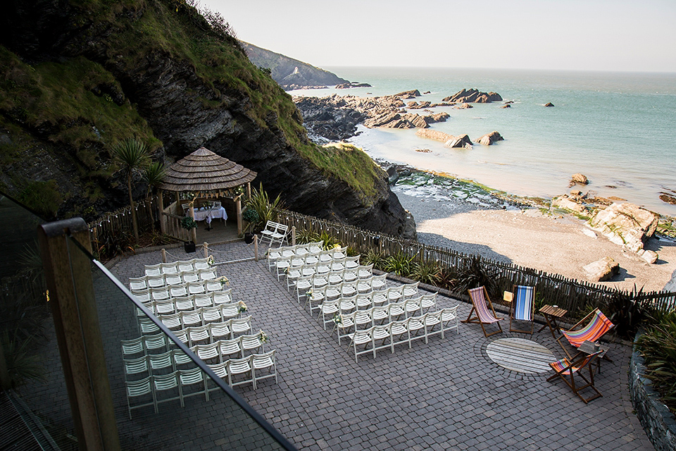 Bride Louisa wears a polka dot gown by Cathrine Deane for her seaside wedding in Devon.