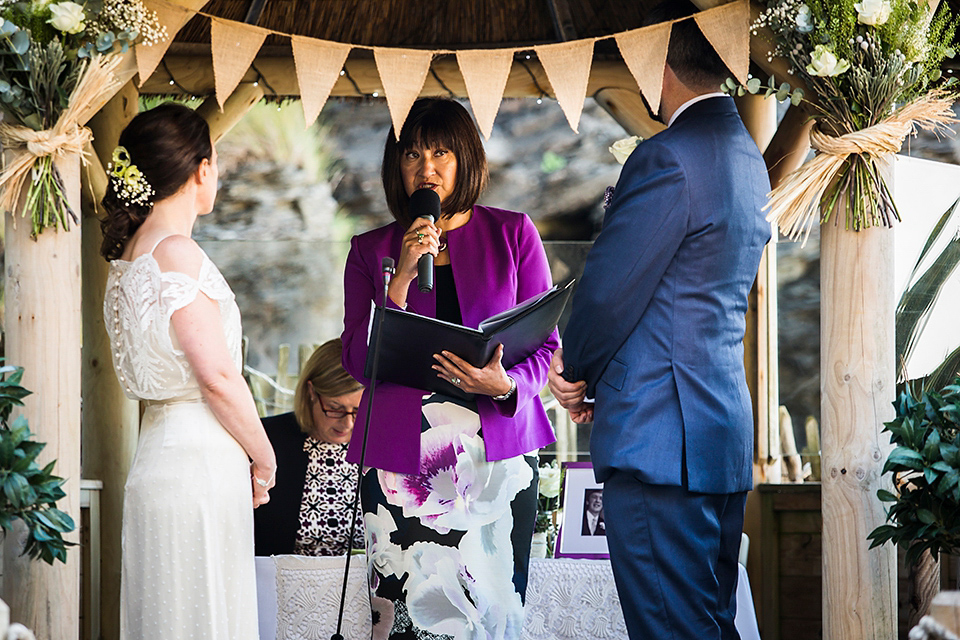 Bride Louisa wears a polka dot gown by Cathrine Deane for her seaside wedding in Devon.