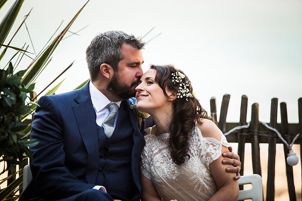 Bride Louisa wears a polka dot gown by Cathrine Deane for her seaside wedding in Devon.