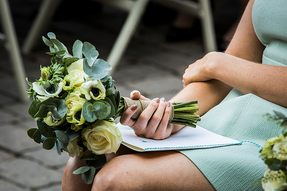 Bride Louisa wears a polka dot gown by Cathrine Deane for her seaside wedding in Devon.