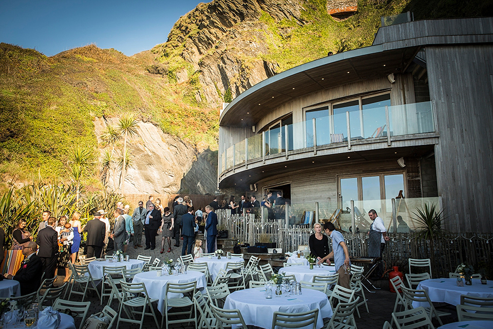 Bride Louisa wears a polka dot gown by Cathrine Deane for her seaside wedding in Devon.