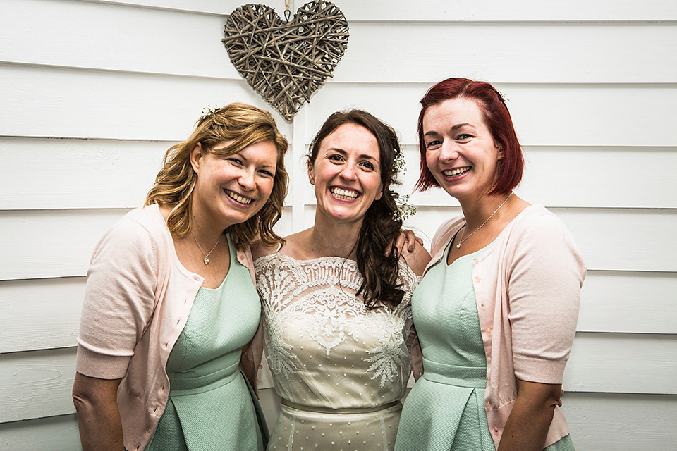 Bride Louisa wears a polka dot gown by Cathrine Deane for her seaside wedding in Devon.