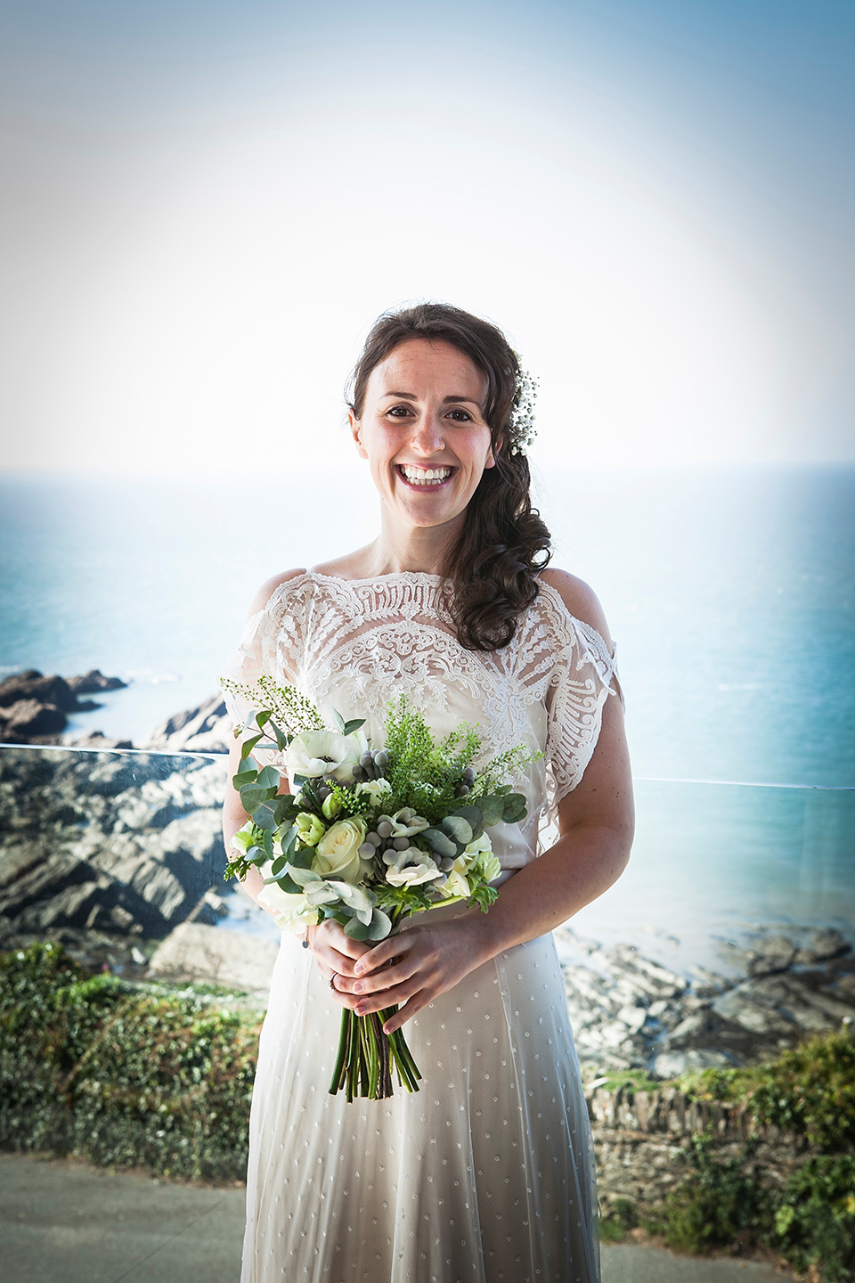 Bride Louisa wears a polka dot gown by Cathrine Deane for her seaside wedding in Devon.