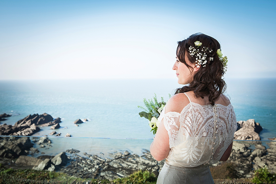 Bride Louisa wears a polka dot gown by Cathrine Deane for her seaside wedding in Devon.