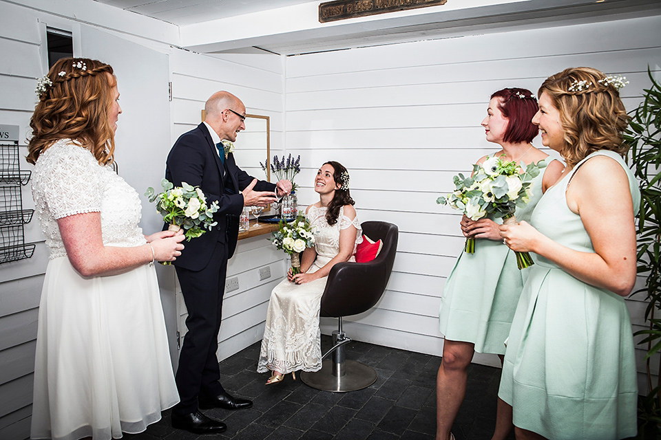 Bride Louisa wears a polka dot gown by Cathrine Deane for her seaside wedding in Devon.