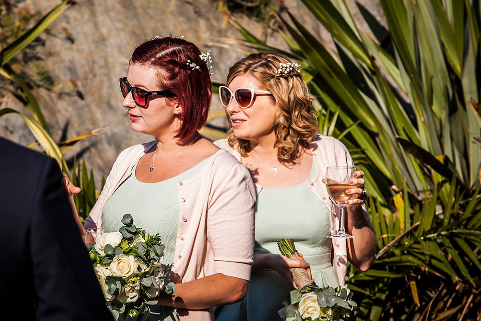 Bride Louisa wears a polka dot gown by Cathrine Deane for her seaside wedding in Devon.