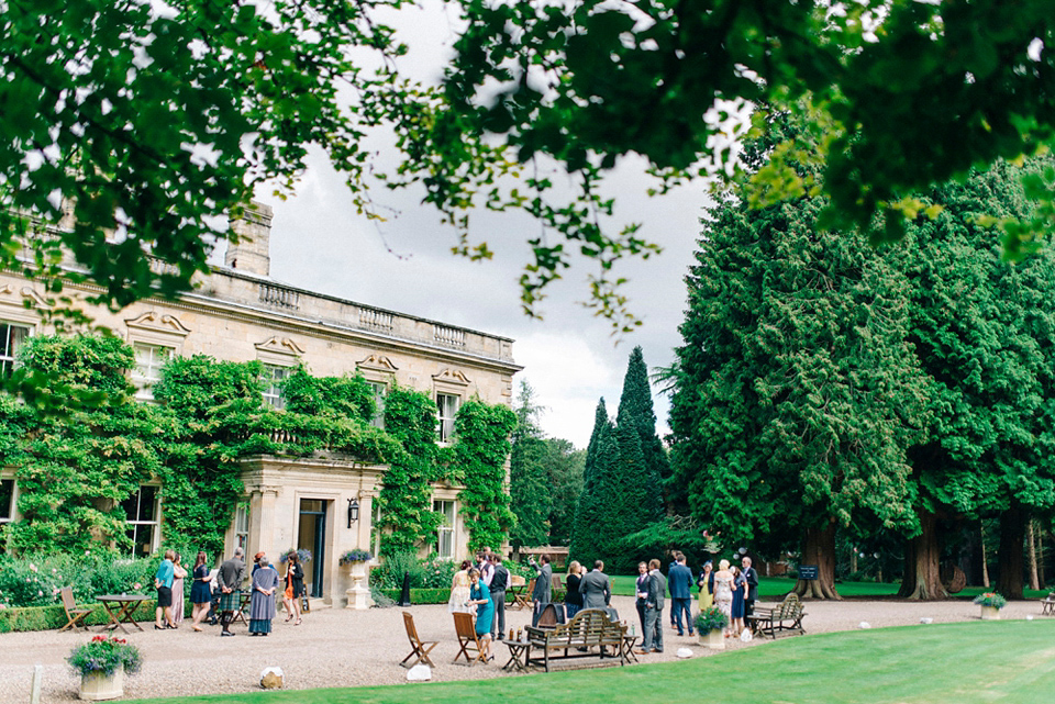 Bride Laura wears an Anoushka G gown for her late Summer wedding at Eshott Hall in Northumberland. Photography by Sarah Jane Ethan.