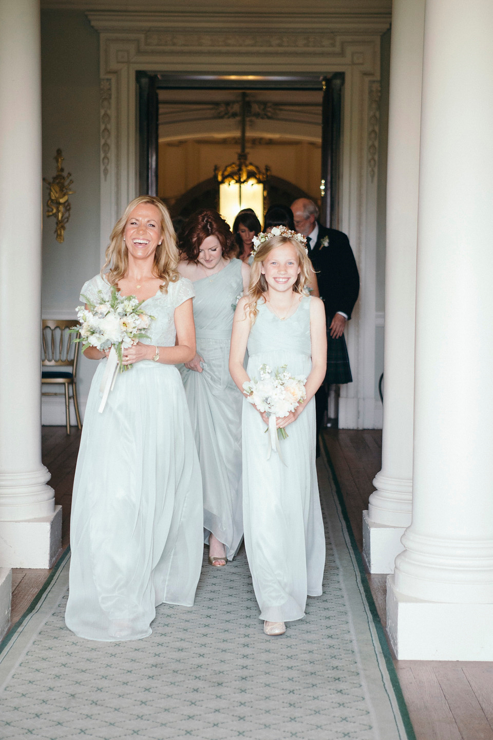 Bride Jenny wore a Rosa Clara wedding dress and a second shorter dress for dancing in at her pale green and botanical inspired wedding. Photography by Mirrorbox.