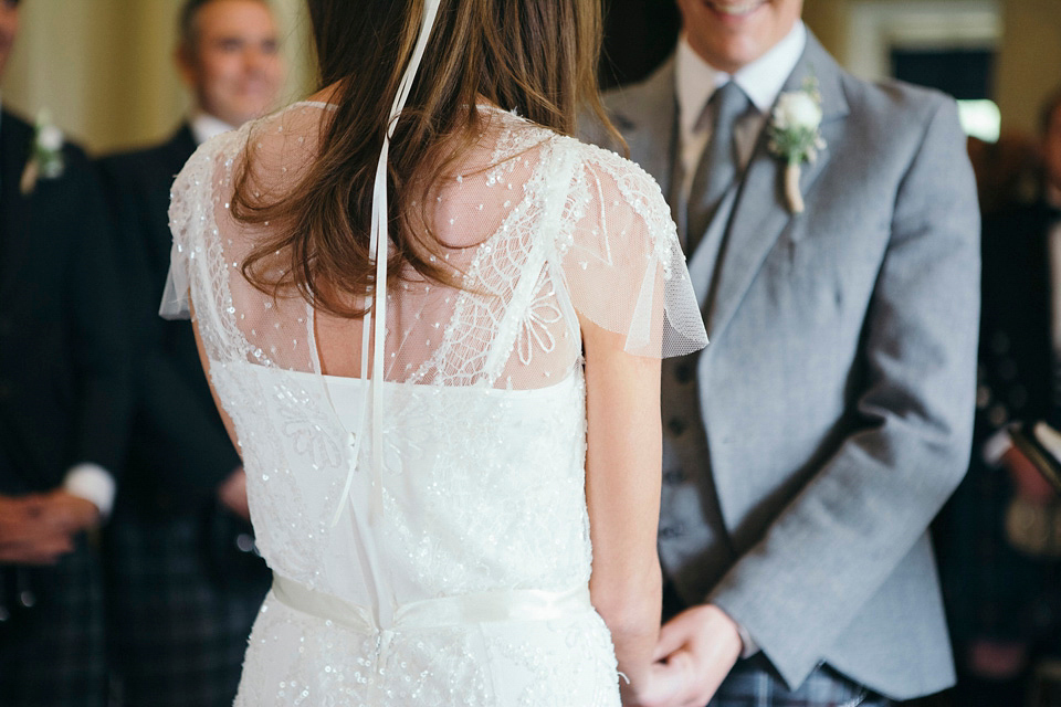 Bride Jenny wore a Rosa Clara wedding dress and a second shorter dress for dancing in at her pale green and botanical inspired wedding. Photography by Mirrorbox.