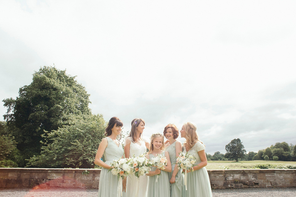 Bride Jenny wore a Rosa Clara wedding dress and a second shorter dress for dancing in at her pale green and botanical inspired wedding. Photography by Mirrorbox.