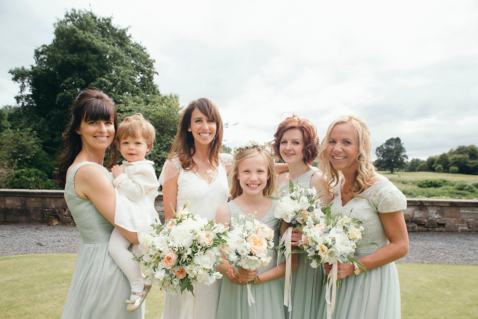 Bride Jenny wore a Rosa Clara wedding dress and a second shorter dress for dancing in at her pale green and botanical inspired wedding. Photography by Mirrorbox.