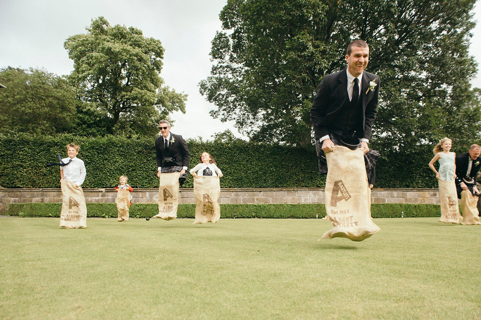 Bride Jenny wore a Rosa Clara wedding dress and a second shorter dress for dancing in at her pale green and botanical inspired wedding. Photography by Mirrorbox.