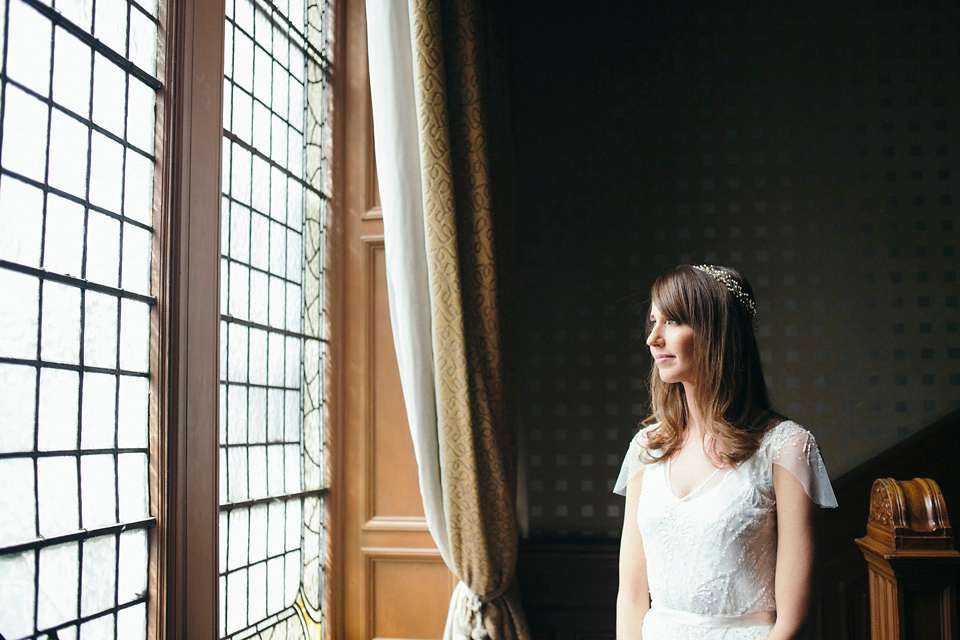 Bride Jenny wore a Rosa Clara wedding dress and a second shorter dress for dancing in at her pale green and botanical inspired wedding. Photography by Mirrorbox.