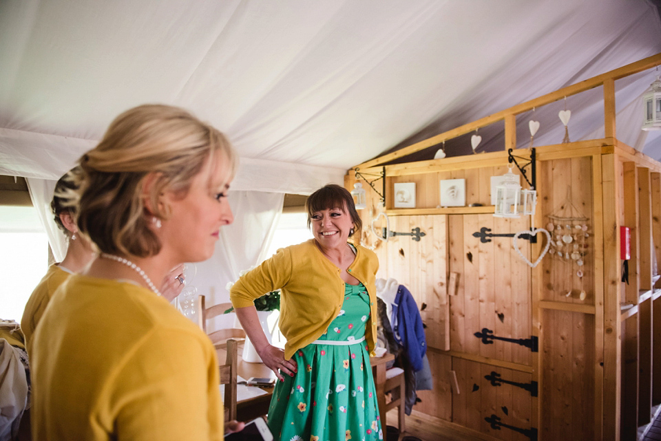 A 1950's vintage dress for a yellow and green Humanist tipi wedding in Scotland. Images by Mack Photo.