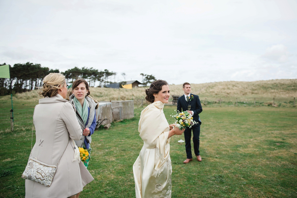 A 1950's vintage dress for a yellow and green Humanist tipi wedding in Scotland. Images by Mack Photo.