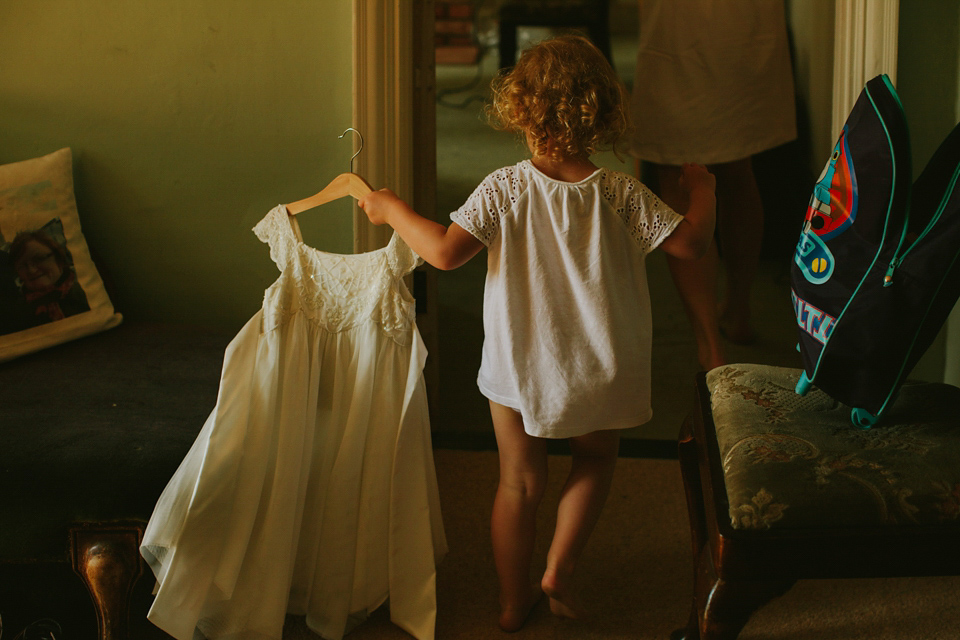 Alex wears a Pronovias gown for her English country barn wedding. Photography by Craig and Kate.