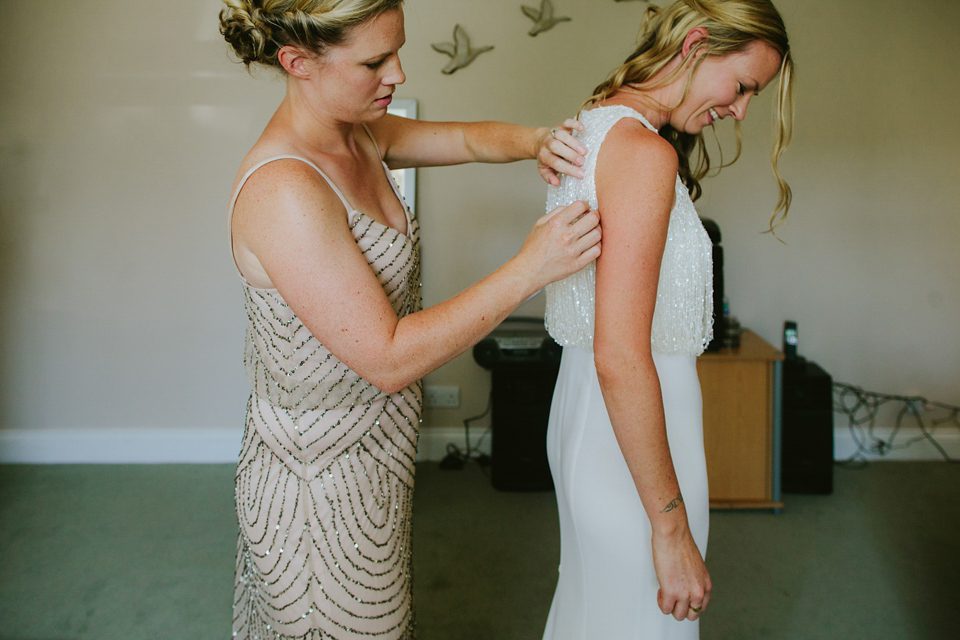 Alex wears a Pronovias gown for her English country barn wedding. Photography by Craig and Kate.