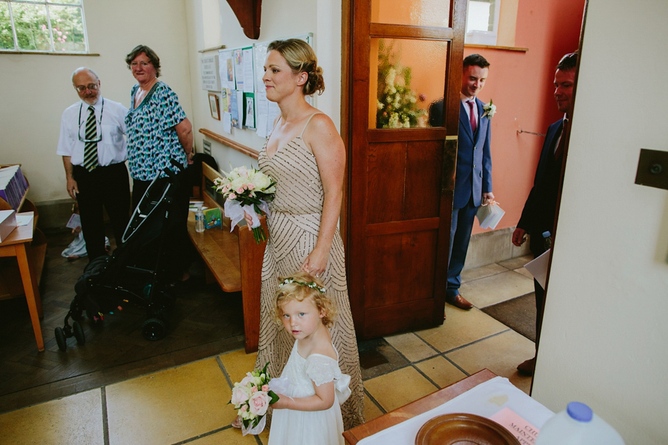 Alex wears a Pronovias gown for her English country barn wedding. Photography by Craig and Kate.