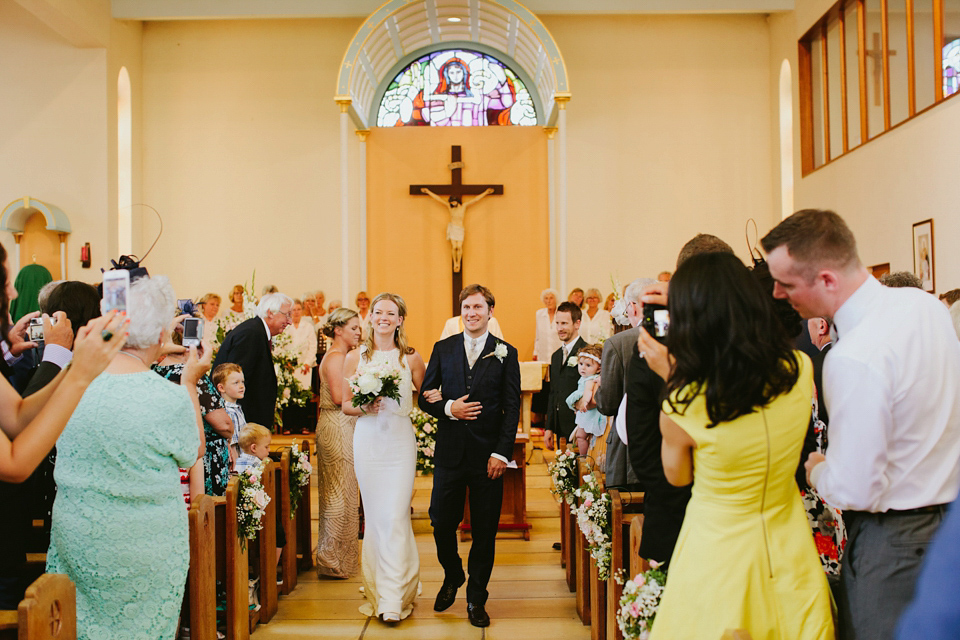 Alex wears a Pronovias gown for her English country barn wedding. Photography by Craig and Kate.