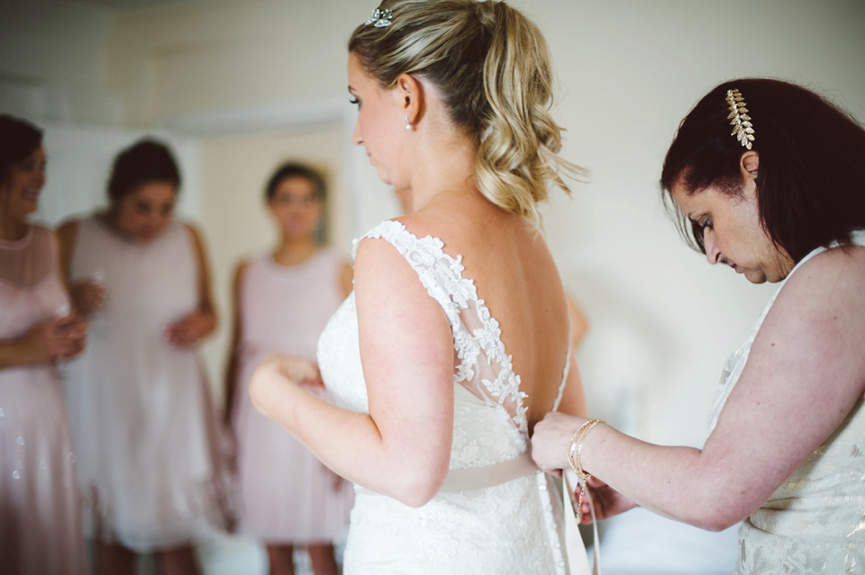 A joy filled barn wedding in shades of gold and pink, with a beautiful bride in a Stella York gown. Images by Mustard Yellow Photography.