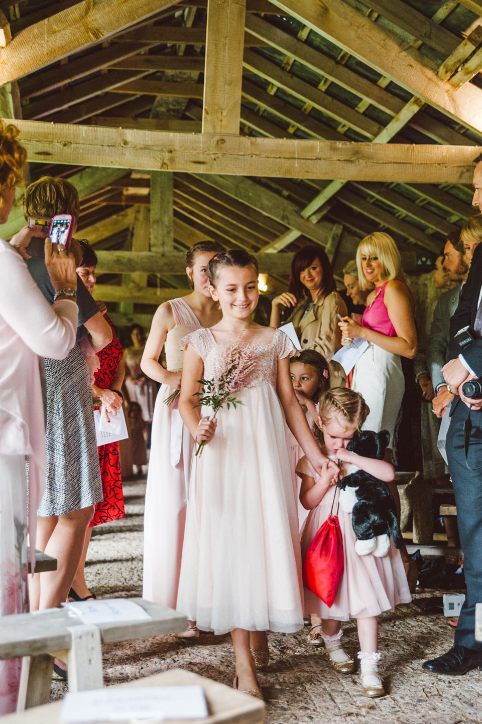 A joy filled barn wedding in shades of gold and pink, with a beautiful bride in a Stella York gown. Images by Mustard Yellow Photography.