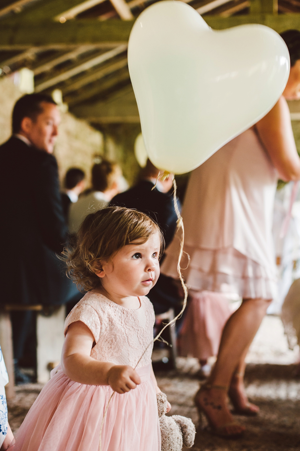 A joy filled barn wedding in shades of gold and pink, with a beautiful bride in a Stella York gown. Images by Mustard Yellow Photography.