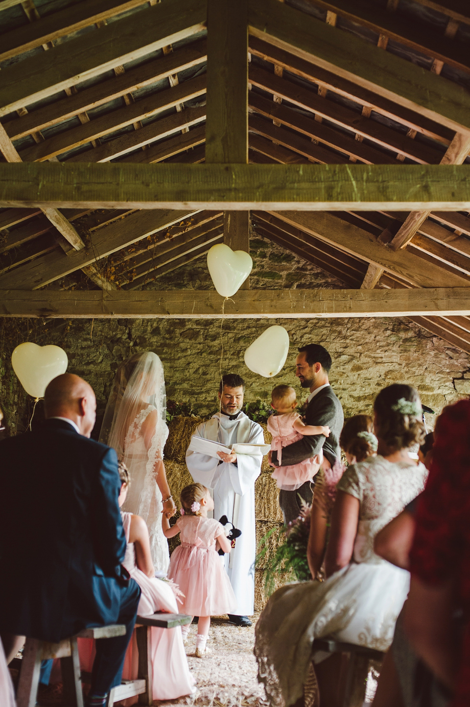 A joy filled barn wedding in shades of gold and pink, with a beautiful bride in a Stella York gown. Images by Mustard Yellow Photography.