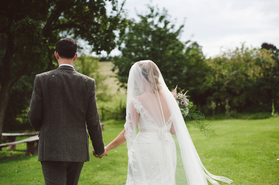 A joy filled barn wedding in shades of gold and pink, with a beautiful bride in a Stella York gown. Images by Mustard Yellow Photography.