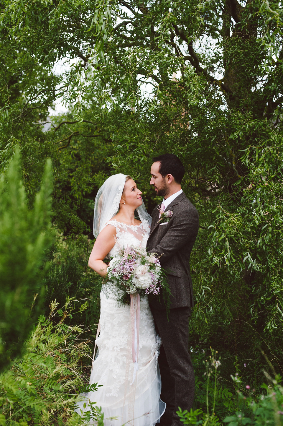 A joy filled barn wedding in shades of gold and pink, with a beautiful bride in a Stella York gown. Images by Mustard Yellow Photography.