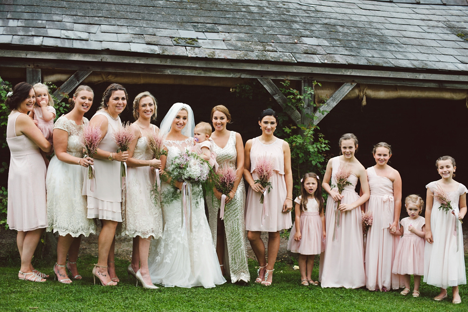 A joy filled barn wedding in shades of gold and pink, with a beautiful bride in a Stella York gown. Images by Mustard Yellow Photography.