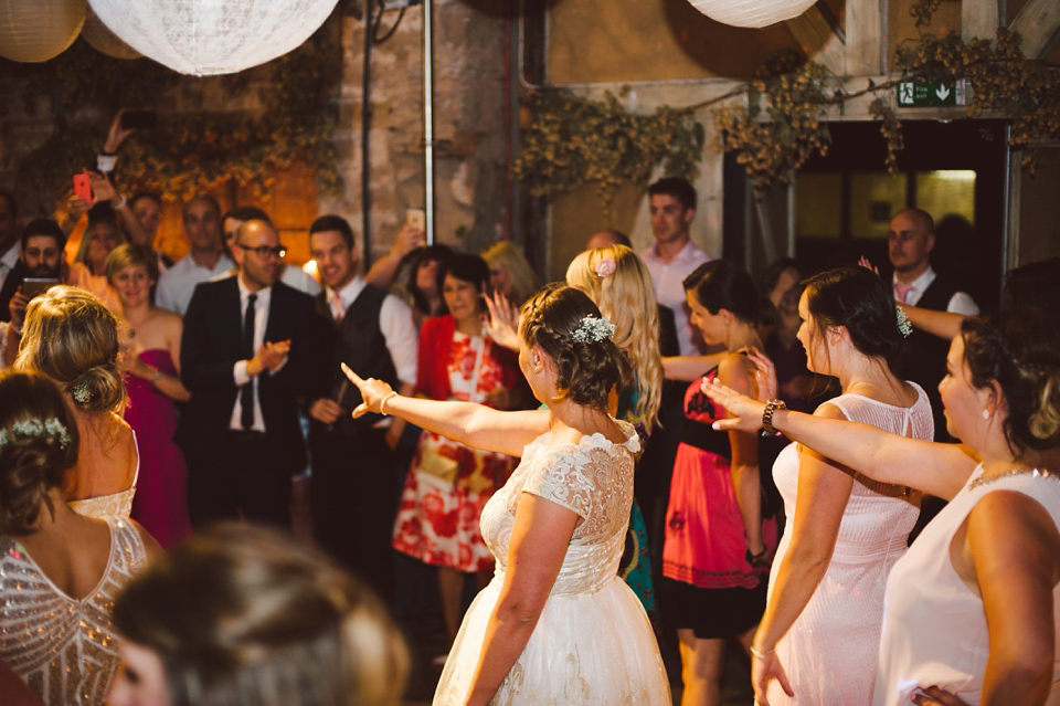 A joy filled barn wedding in shades of gold and pink, with a beautiful bride in a Stella York gown. Images by Mustard Yellow Photography.