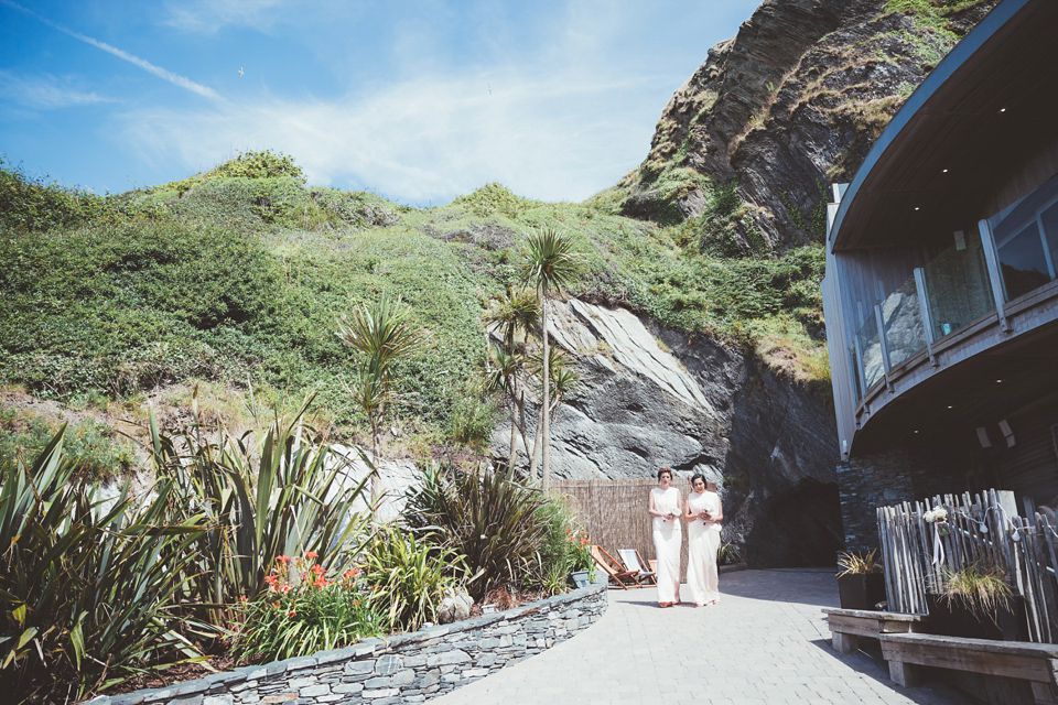 Charlotte wears a Charlotte Simpson gown for her wedding by the sea in Devon. Photography by Philippa James.