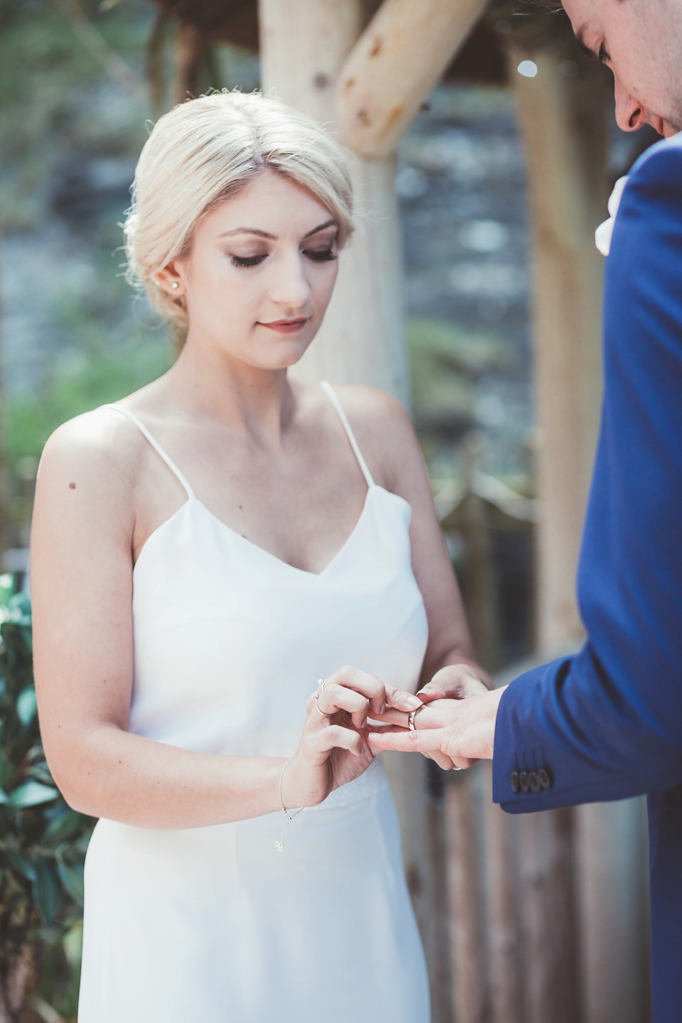 Charlotte wears a Charlotte Simpson gown for her wedding by the sea in Devon. Photography by Philippa James.