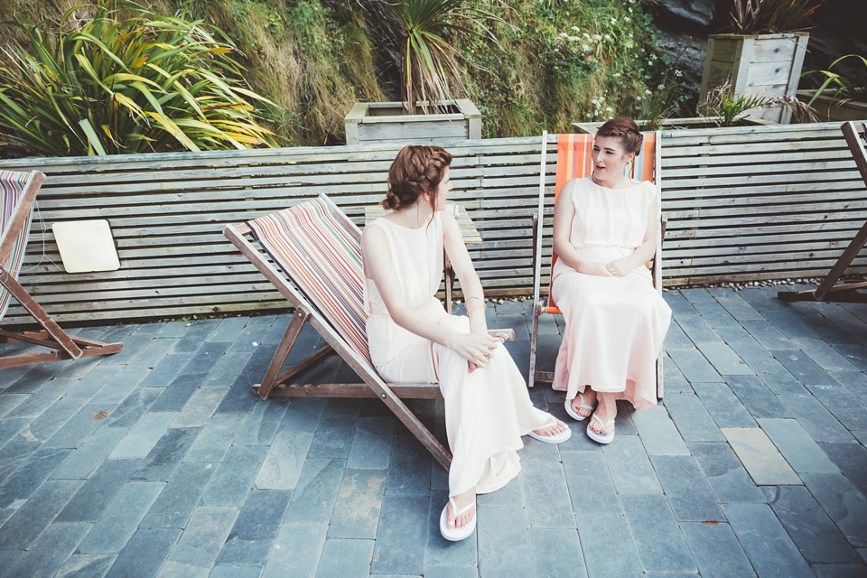 Charlotte wears a Charlotte Simpson gown for her wedding by the sea in Devon. Photography by Philippa James.