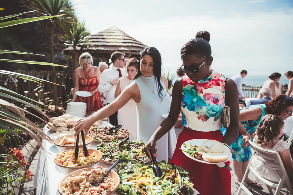 Charlotte wears a Charlotte Simpson gown for her wedding by the sea in Devon. Photography by Philippa James.