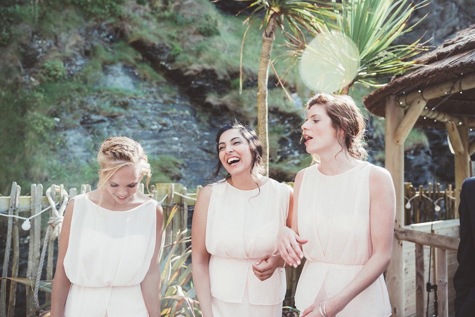 Charlotte wears a Charlotte Simpson gown for her wedding by the sea in Devon. Photography by Philippa James.