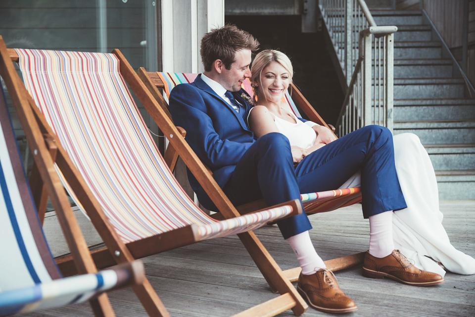 Charlotte wears a Charlotte Simpson gown for her wedding by the sea in Devon. Photography by Philippa James.