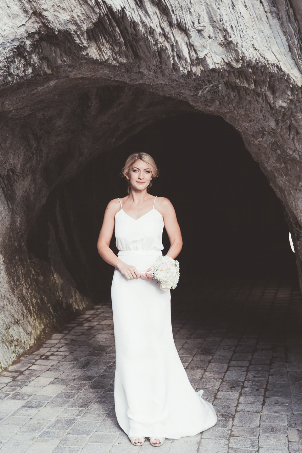 Charlotte wears a Charlotte Simpson gown for her wedding by the sea in Devon. Photography by Philippa James.