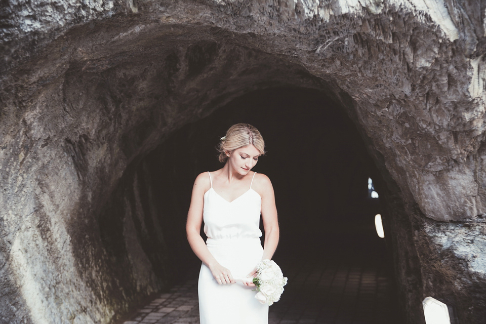 Charlotte wears a Charlotte Simpson gown for her wedding by the sea in Devon. Photography by Philippa James.