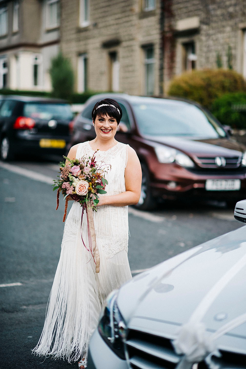 Hayley wore a 1920s tasseled dress by Phase Eight for her Autumn Wedding. Photography by Kerry Woods.