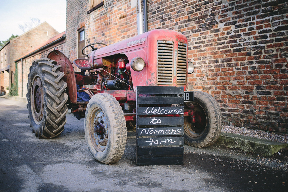 Laura wears 'Mimosa' by Jenny Packham for her winter wedding on the family farm in York. Photography by Kate Gray.