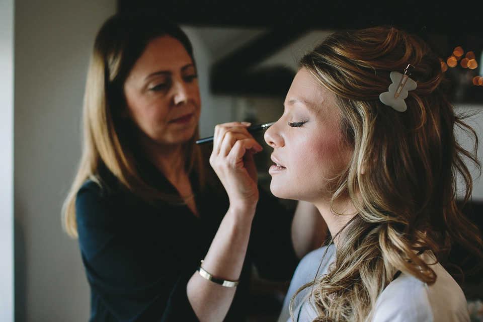 Laura wears 'Mimosa' by Jenny Packham for her winter wedding on the family farm in York. Photography by Kate Gray.