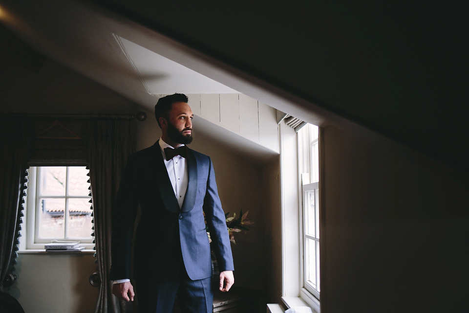 Laura wears 'Mimosa' by Jenny Packham for her winter wedding on the family farm in York. Photography by Kate Gray.