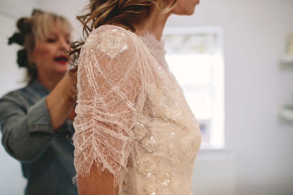 Laura wears 'Mimosa' by Jenny Packham for her winter wedding on the family farm in York. Photography by Kate Gray.