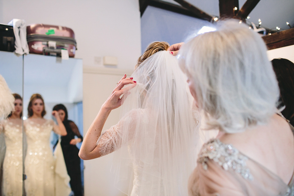 Laura wears 'Mimosa' by Jenny Packham for her winter wedding on the family farm in York. Photography by Kate Gray.