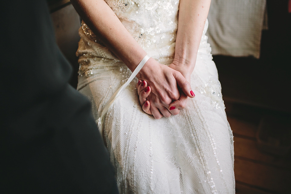 Laura wears 'Mimosa' by Jenny Packham for her winter wedding on the family farm in York. Photography by Kate Gray.
