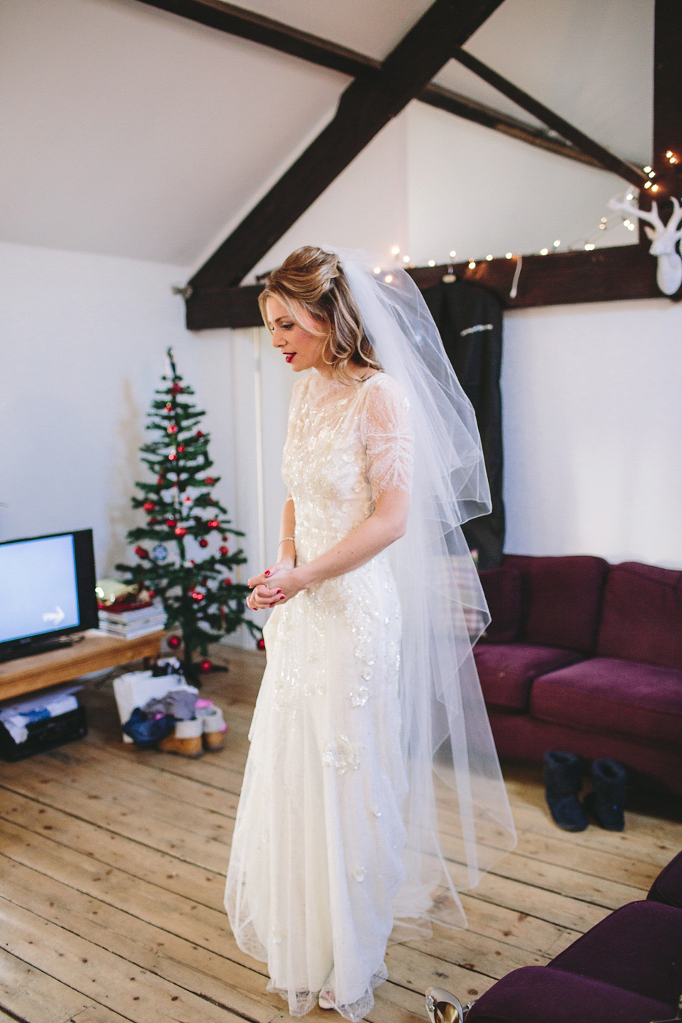 Laura wears 'Mimosa' by Jenny Packham for her winter wedding on the family farm in York. Photography by Kate Gray.