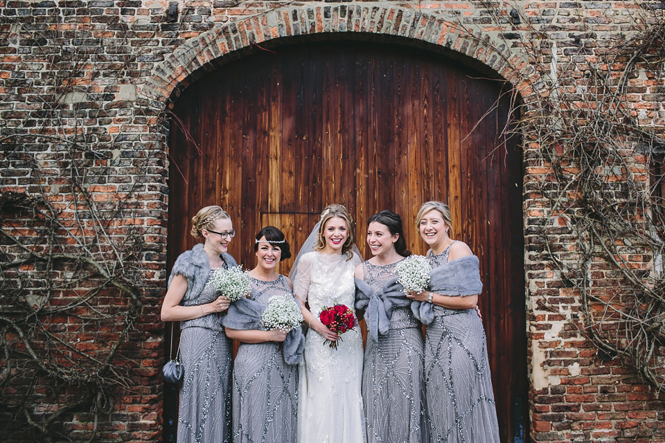 Laura wears 'Mimosa' by Jenny Packham for her winter wedding on the family farm in York. Photography by Kate Gray.