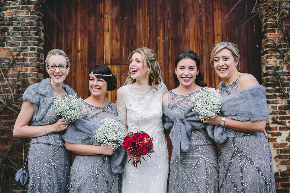 Laura wears 'Mimosa' by Jenny Packham for her winter wedding on the family farm in York. Photography by Kate Gray.